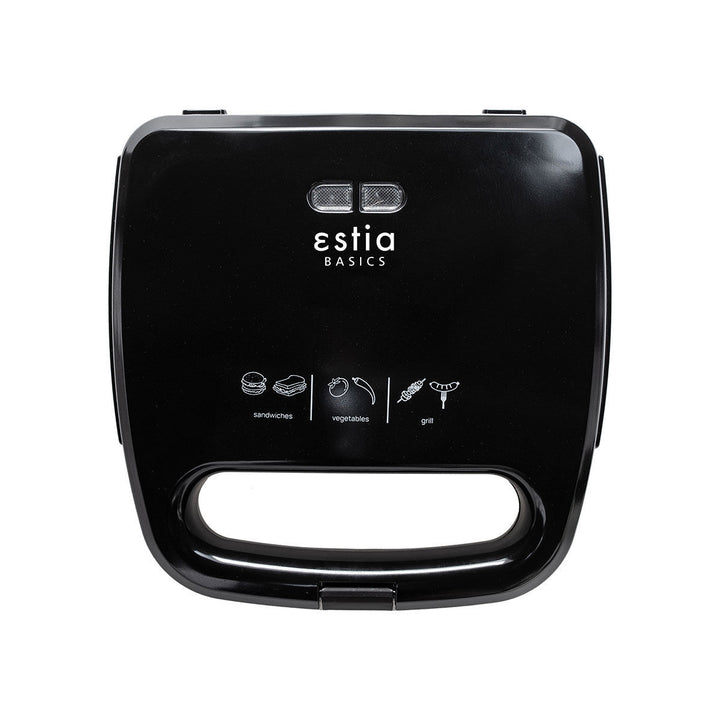 Τοστιέρα Estia Basics Black Plus σε μαύρο χρώμα, κλειστή, με λείο καπάκι και ενδείξεις χρήσης, σε λευκό φόντο.