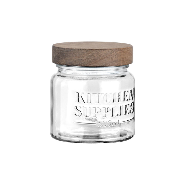 Πλάγια όψη από γυάλινο δοχείο αποθήκευσης Kitchen Supplies με ανάγλυφη επιγραφή, διαφανές σώμα και καπάκι από φυσικό ξύλο, ιδανικό για κουζίνα.