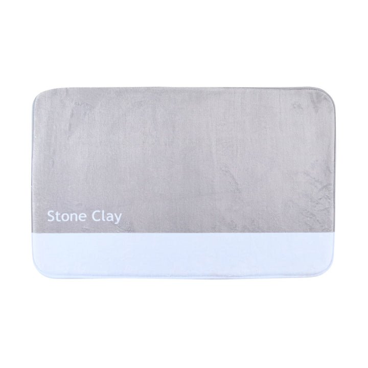 Μπεζ και λευκό ταπέτο μπάνιου με την ένδειξη Stone Clay σε ουδέτερο φόντο.